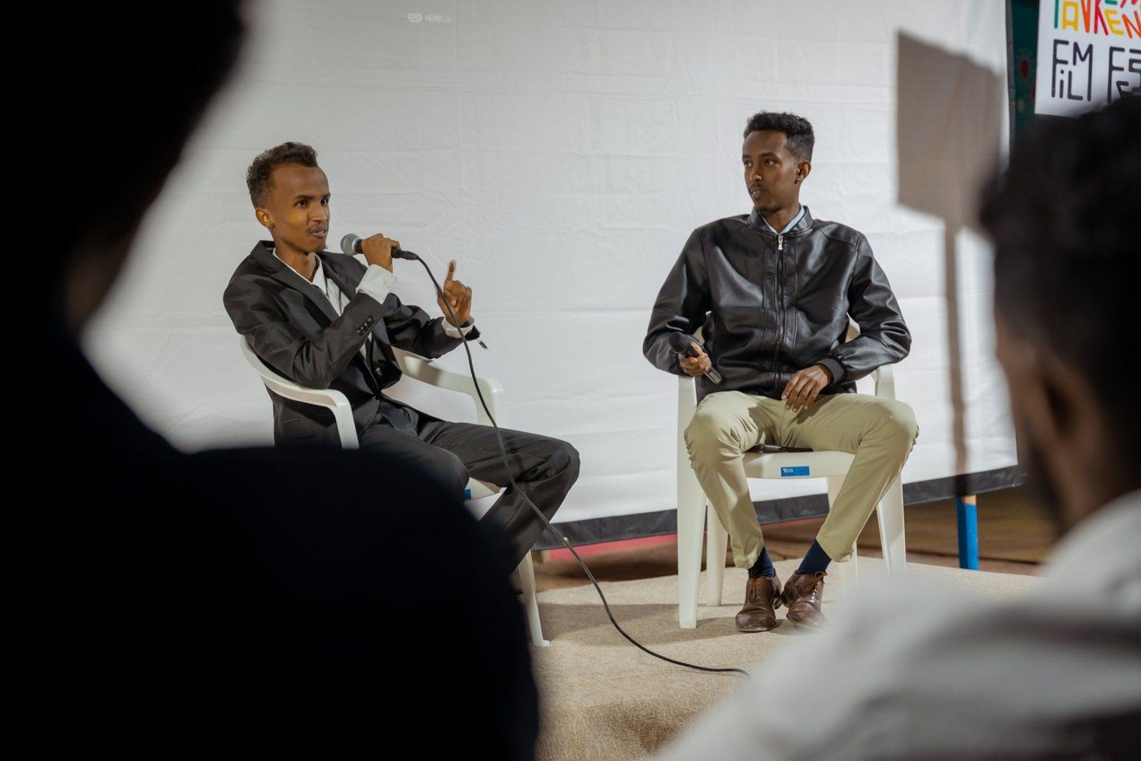 Two filmmakers in conversation on stage