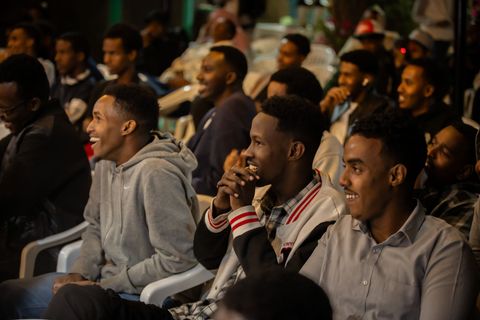 Audience laughing at an open mic night